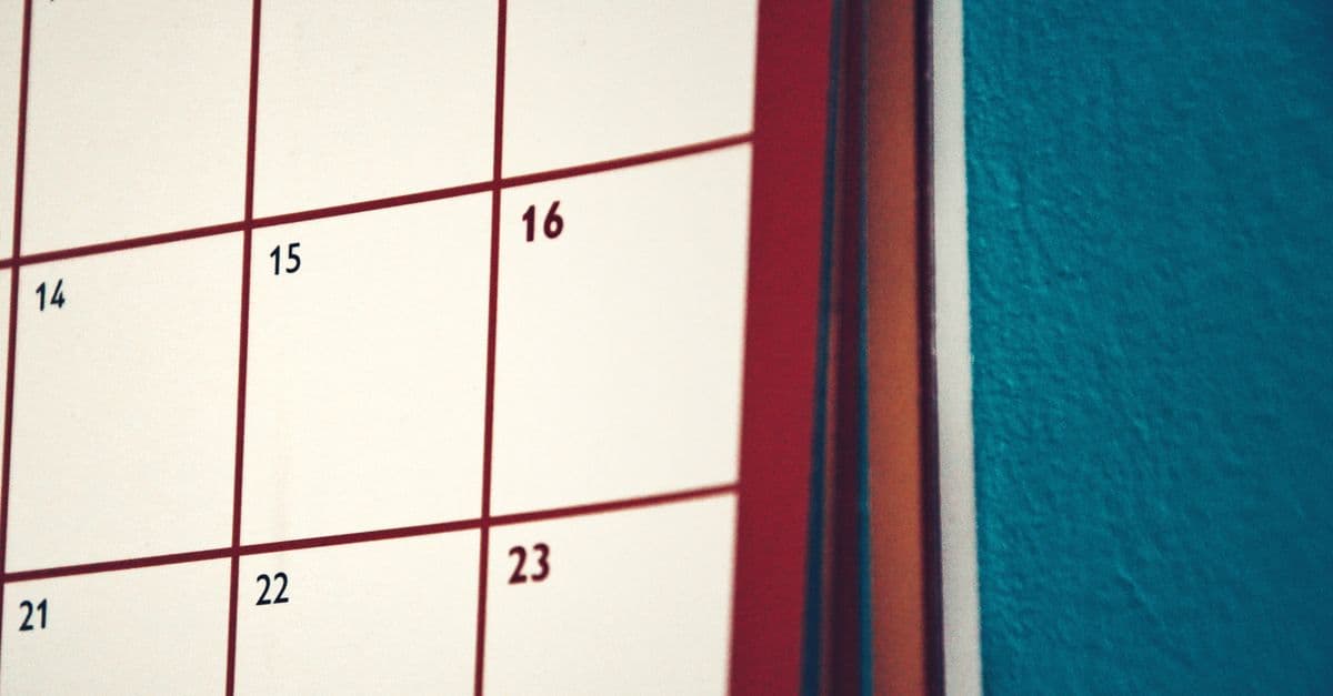 A minimalist calendar hanging on a colorful wall, perfect for planning and organization.